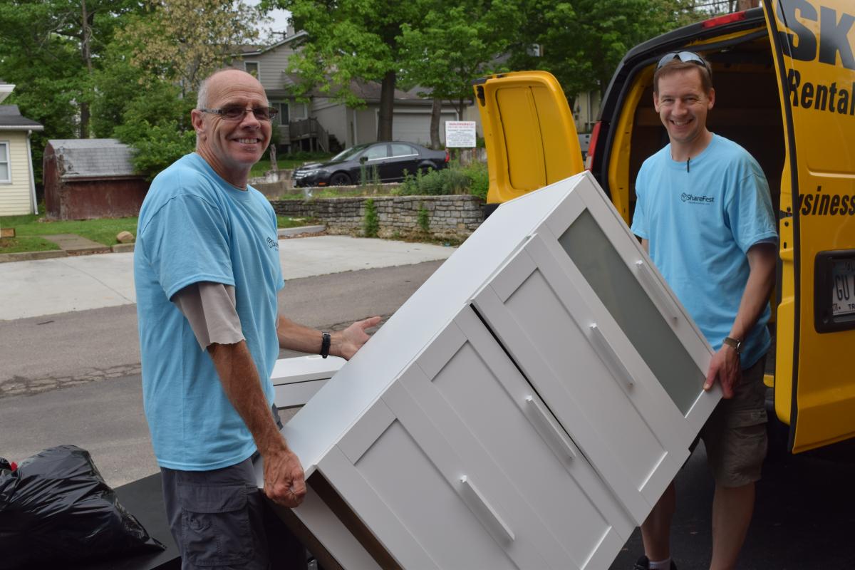 ShareFest 2015 volunteers holding a dresser