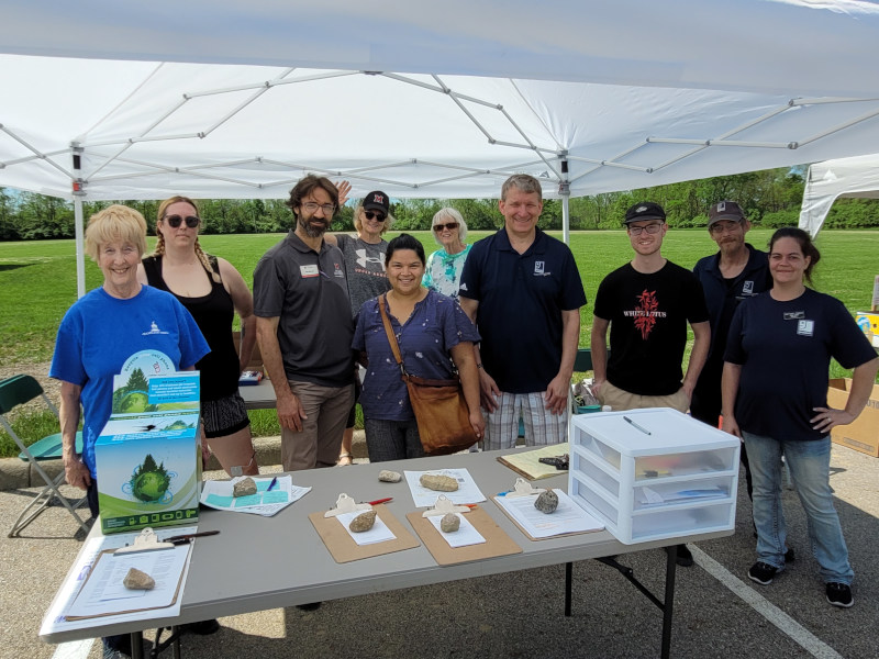 Picture of a group of volunteers under a tent